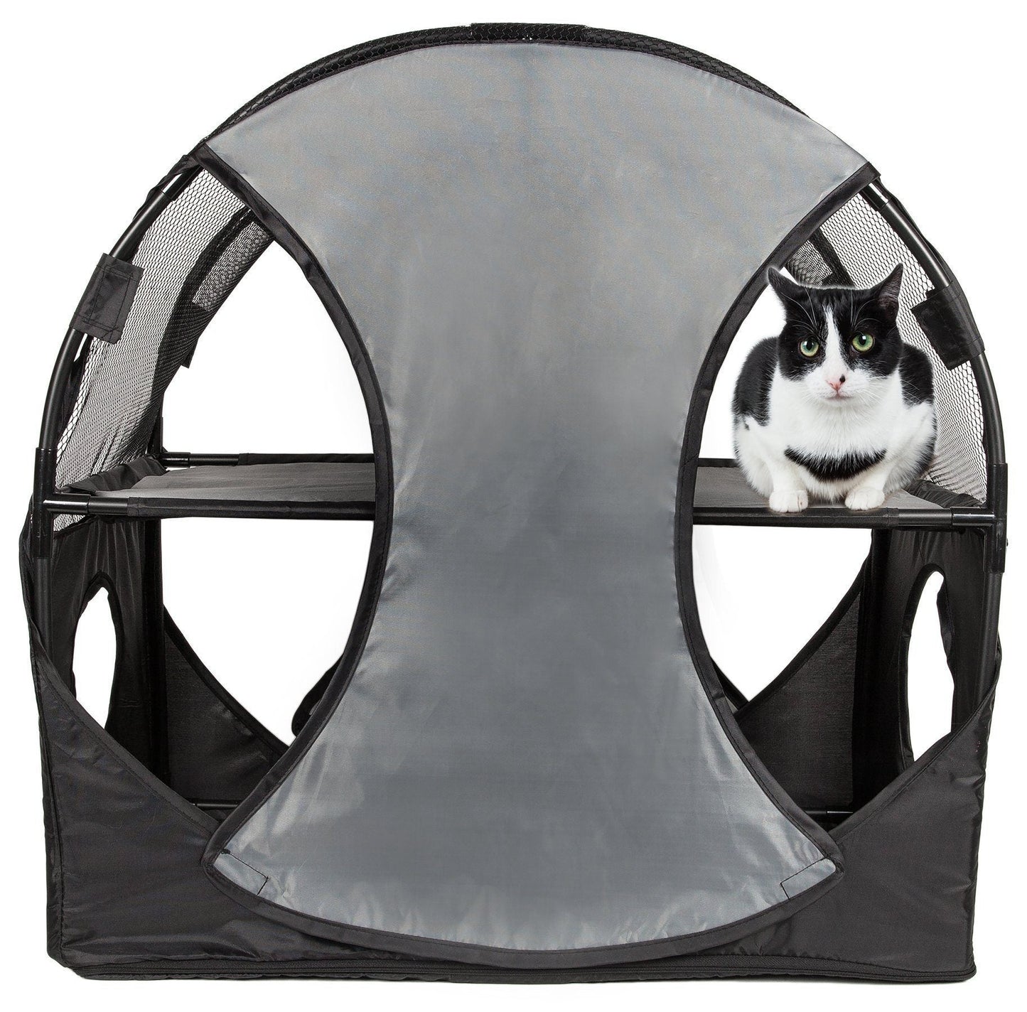 Cat inside a gray pet playpen with mesh sides on a white background