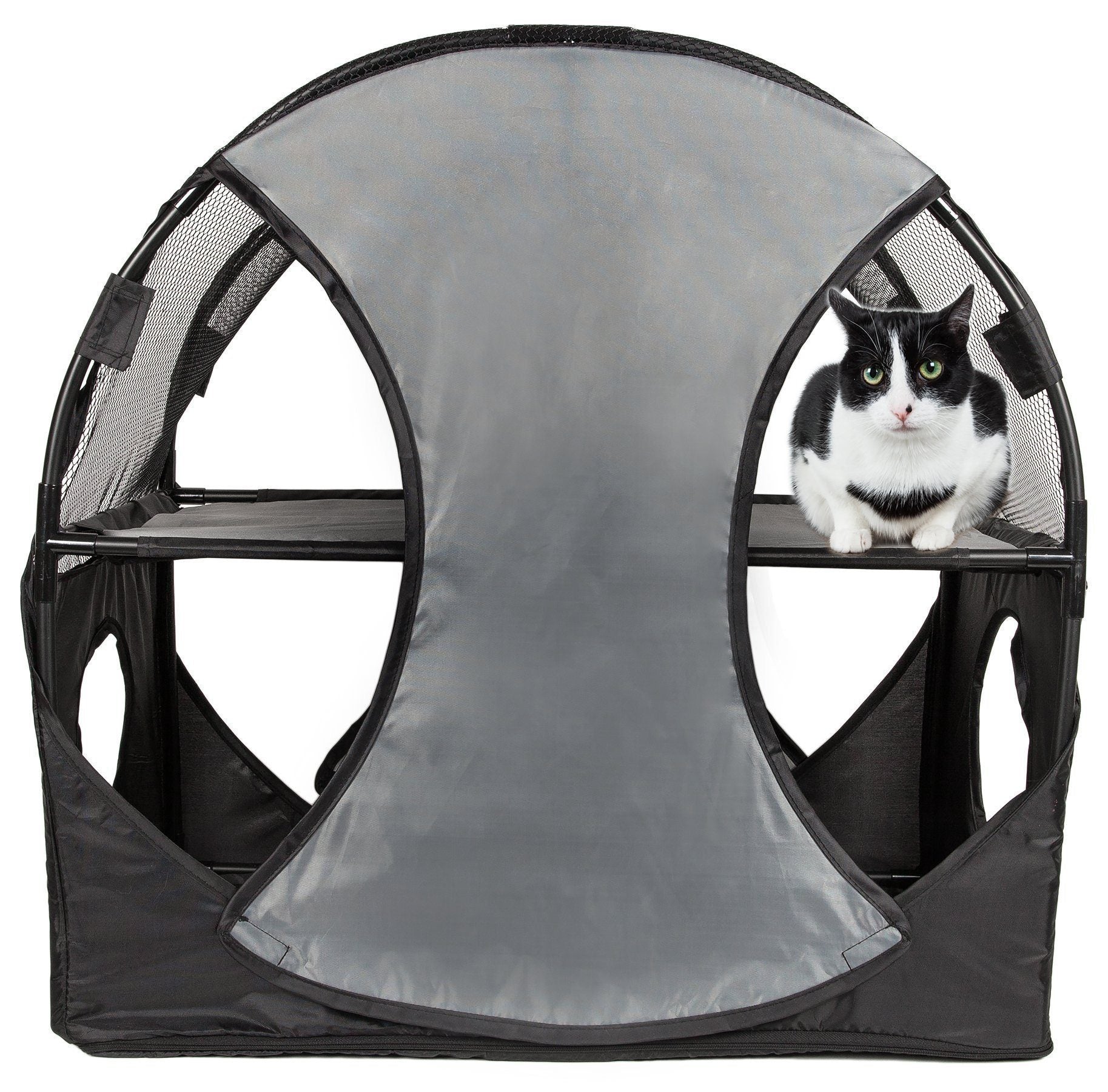 Cat inside a gray pet playpen with mesh sides on a white background