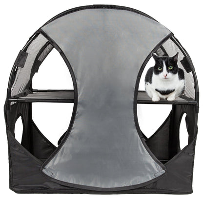 Cat inside a gray pet playpen with mesh sides on a white background