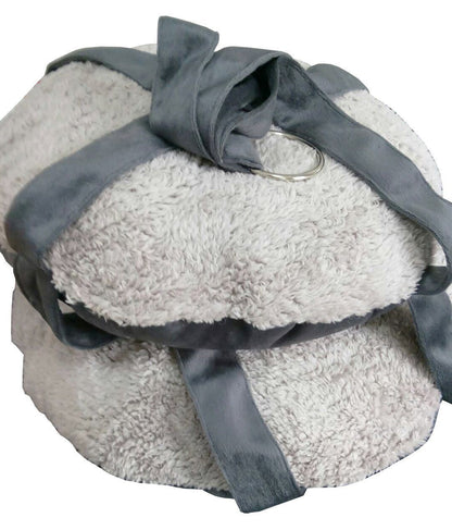Stack of gray towels with a blue ribbon on a white background