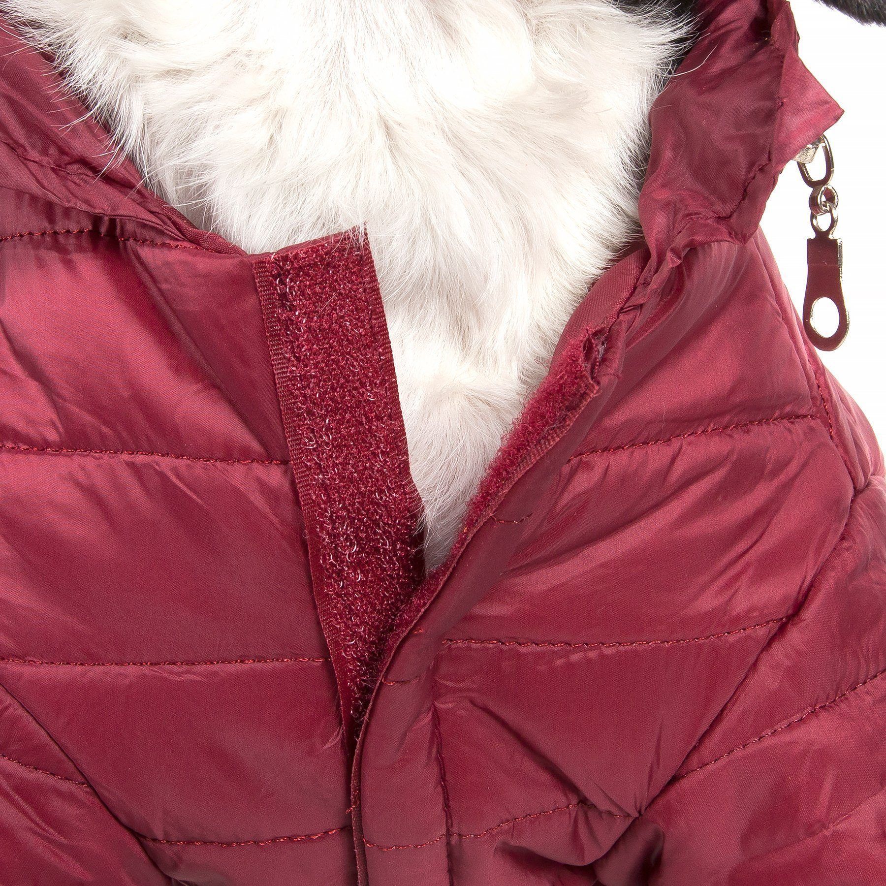 Close-up of a red puffer jacket with white fur lining on a white background
