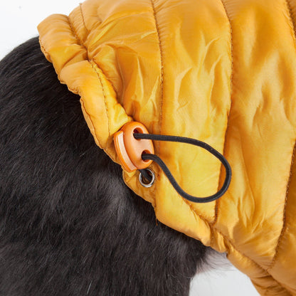 Close-up of a yellow hooded jacket with a black fur collar on a person.