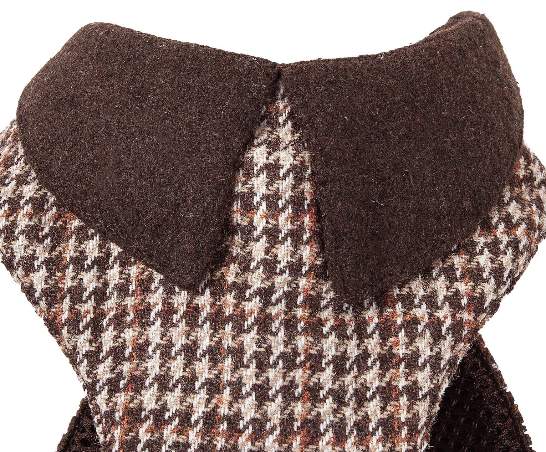 Close-up of a houndstooth patterned fabric with a brown collar on a white background