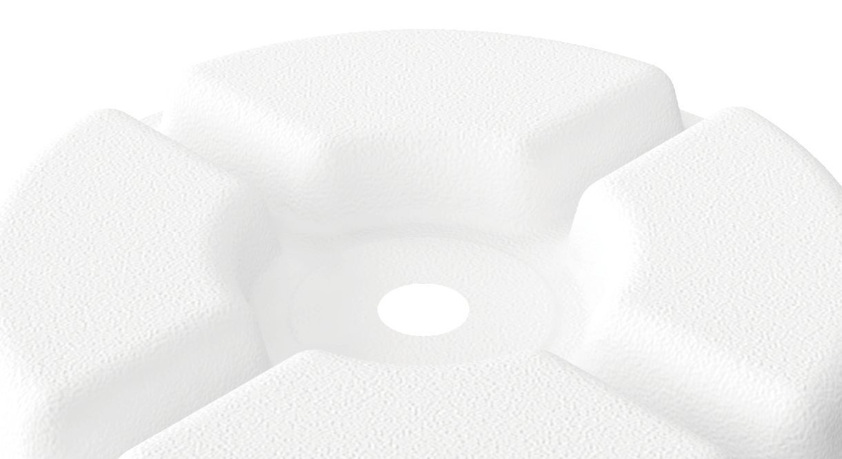 Close-up of a white ceramic sink with a blurred background