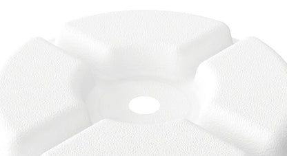 Close-up of a white ceramic sink with a blurred background