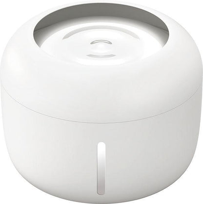 White cylindrical device with a circular top on a white background