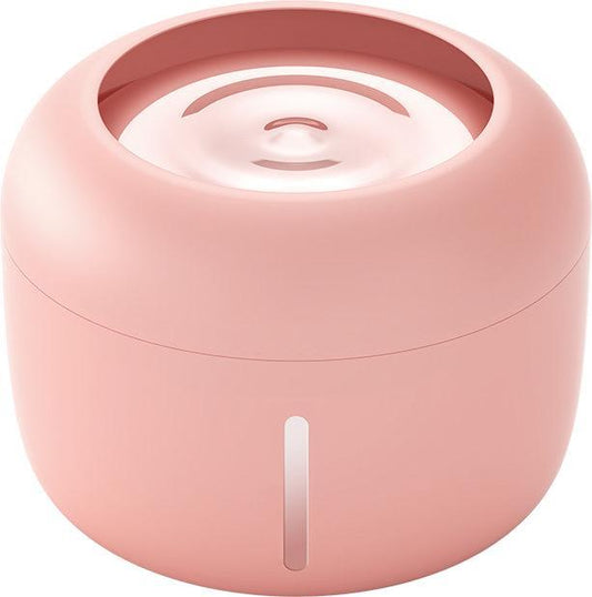 Pink cylindrical device with a white interior on a white background