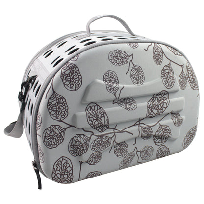 Pet carrier with leaf pattern on a white background