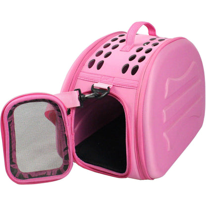 Pink pet carrier with open door on a white background