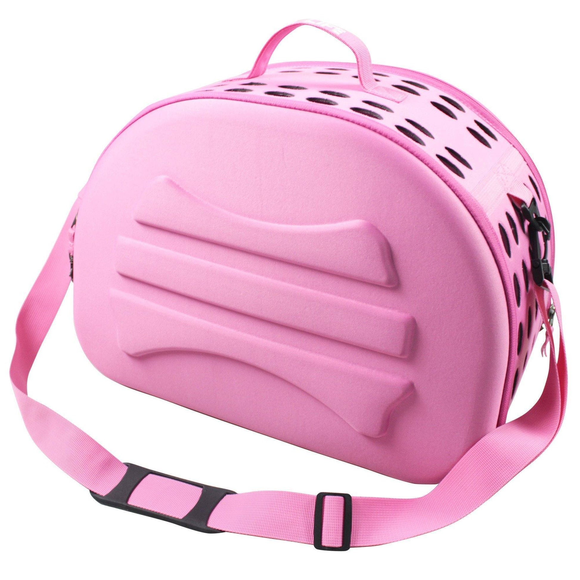 Pink pet carrier with a strap on a white background