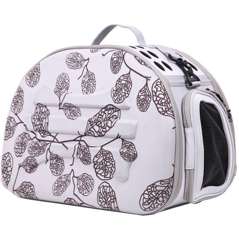 Pet carrier with leaf pattern on a white background