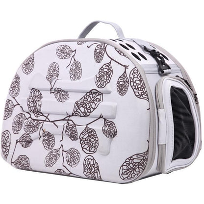 Pet carrier with leaf pattern on a white background