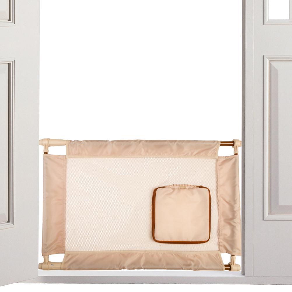 Beige baby gate with a small square mirror attached, placed between two white doors.