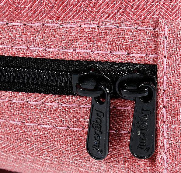 Close-up of a black zipper on a pink textured fabric background