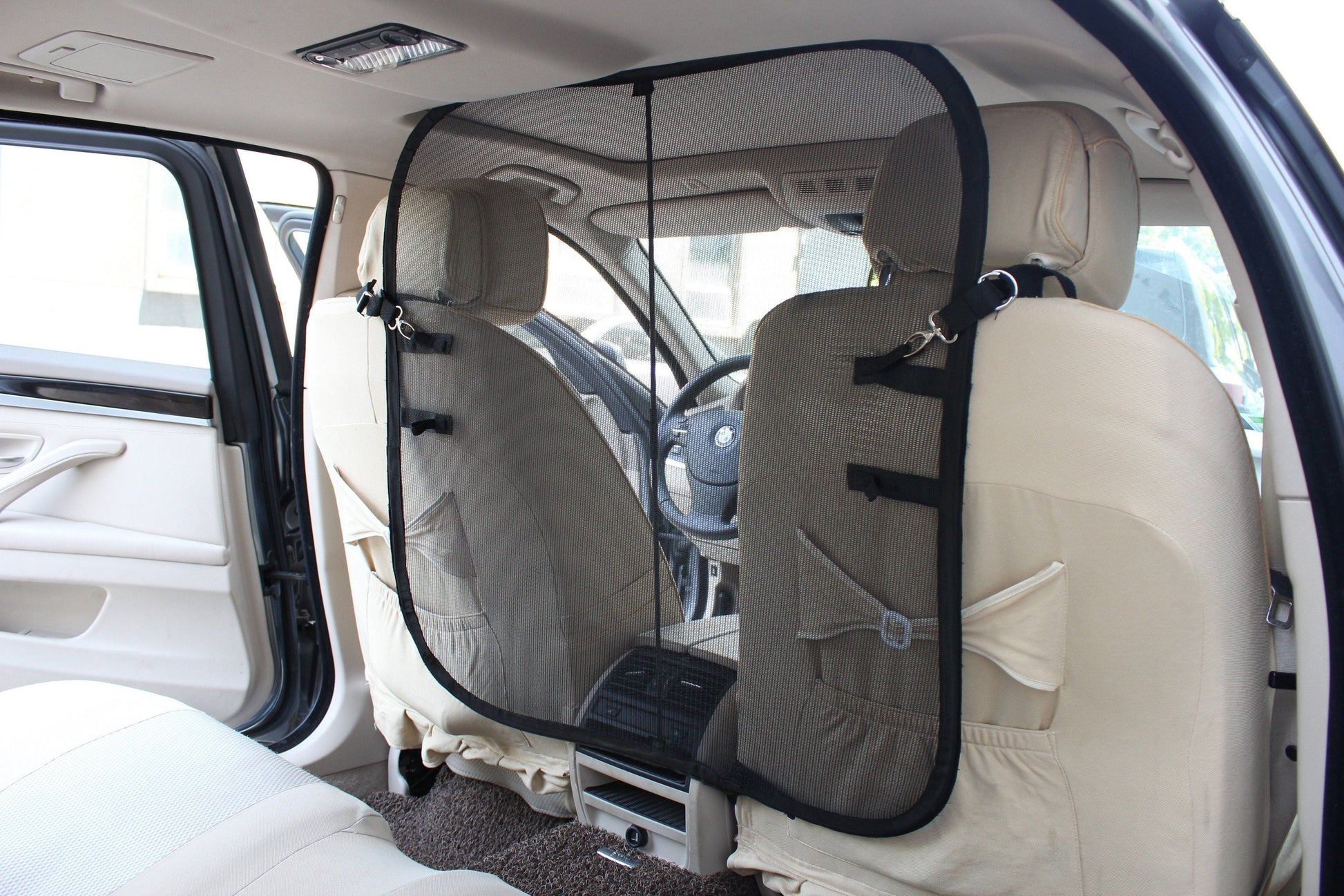 Car interior with a seat cover and headrest protector
