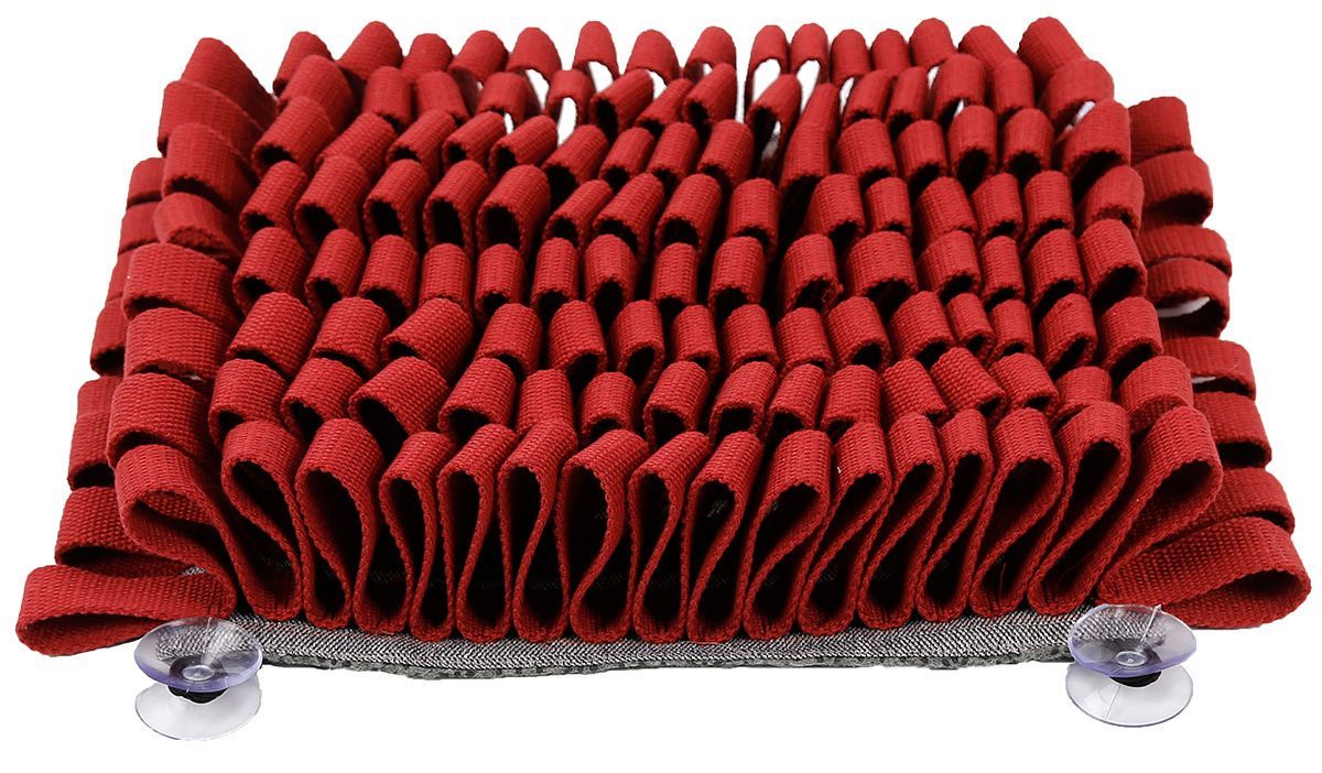 Red textured mat with suction cups on a white background