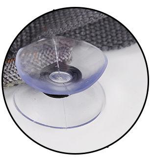 Close-up of a clear suction cup on a textured surface
