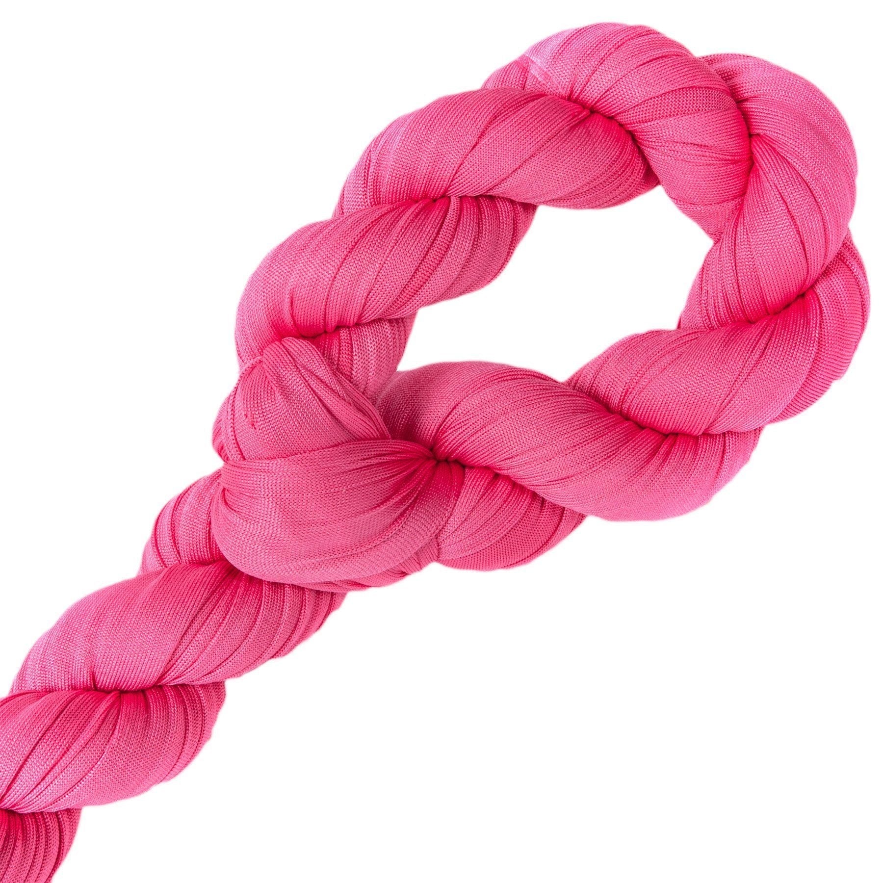 Pink braided toy on a white background
