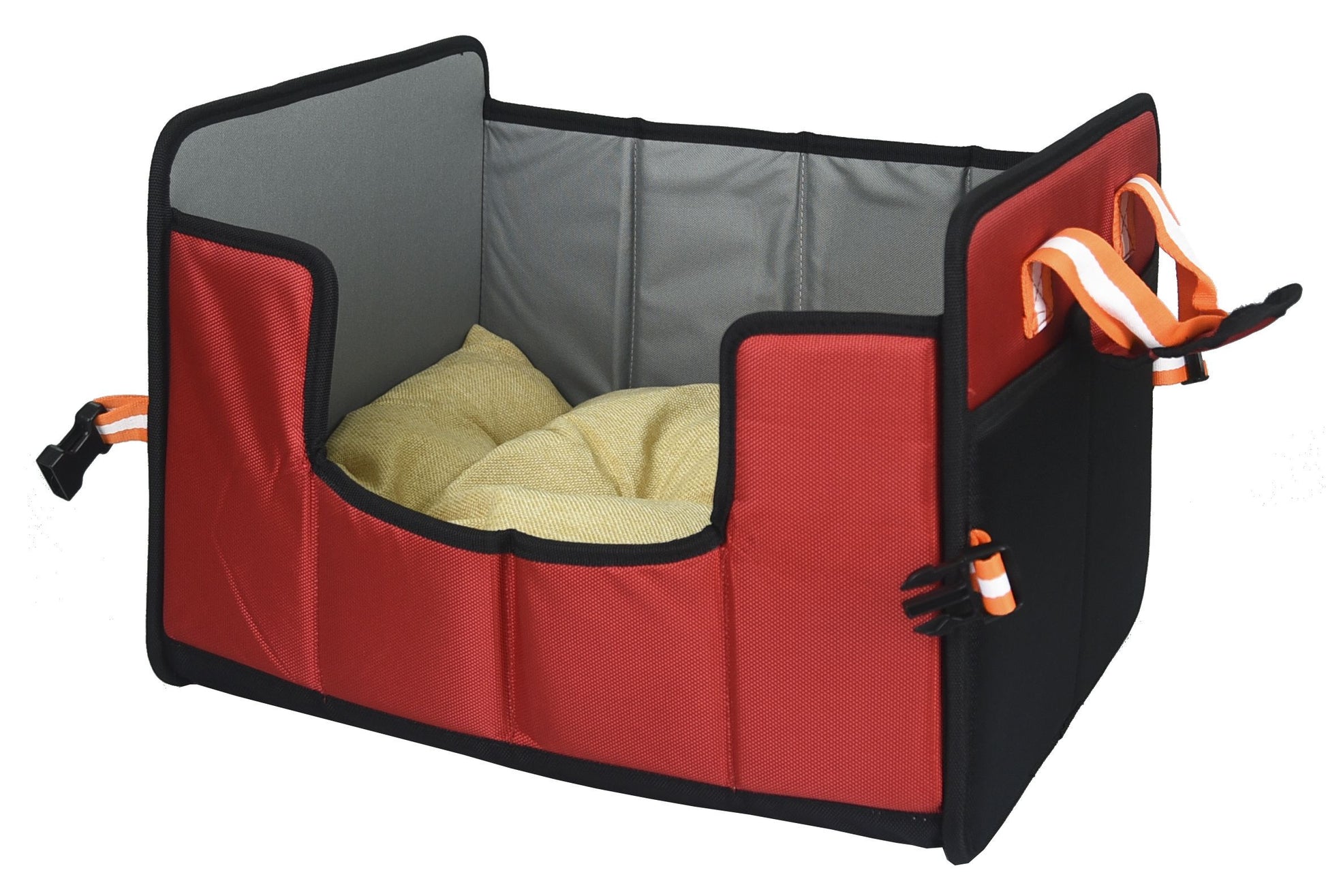 Red pet travel crate with a cushion inside on a white background
