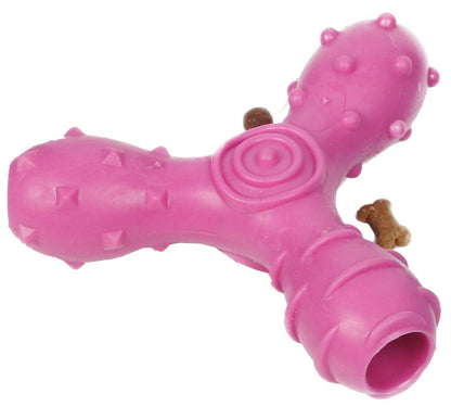 Pink dog toy with textured surface on a white background