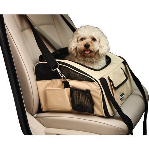 Dog in a beige pet carrier inside a car