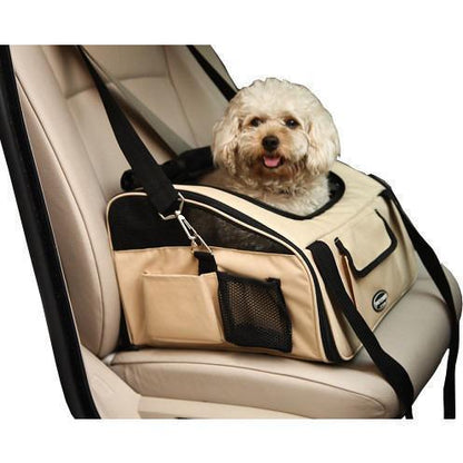 Dog in a beige pet carrier inside a car