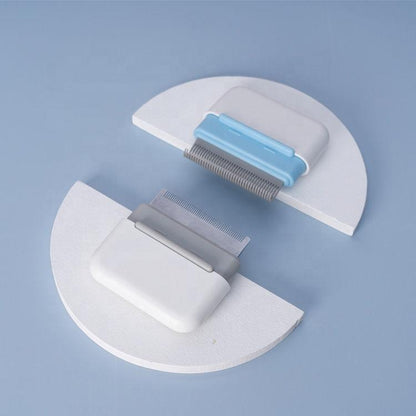 Pet grooming tool with blue and gray components on a light blue background