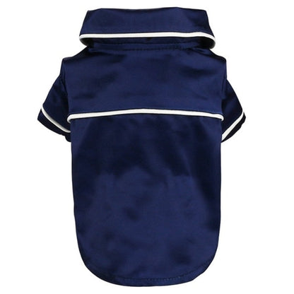 Navy blue dog raincoat with white trim on a white background