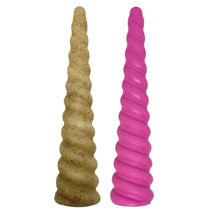 Two textured cylindrical objects, one beige and one pink, on a white background.