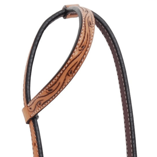 Brown leather headstall with intricate patterns on a white background