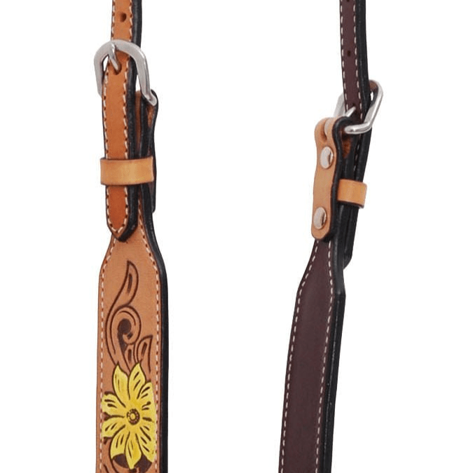 Brown leather strap with floral design and metal hardware on a white background
