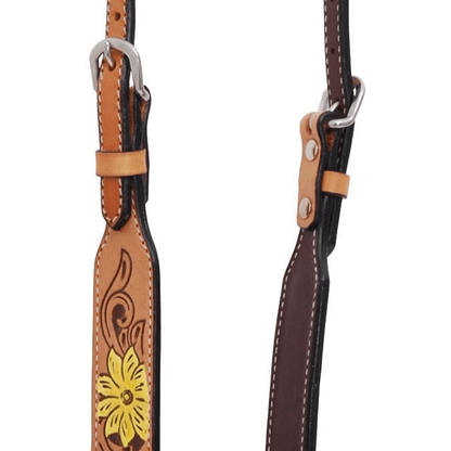 Brown leather strap with floral design and metal hardware on a white background