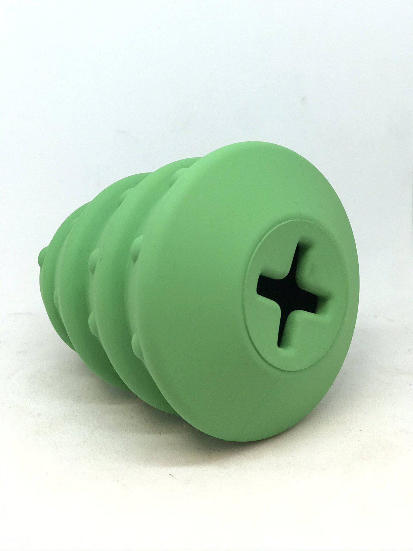 Green silicone screw-shaped object on a white background
