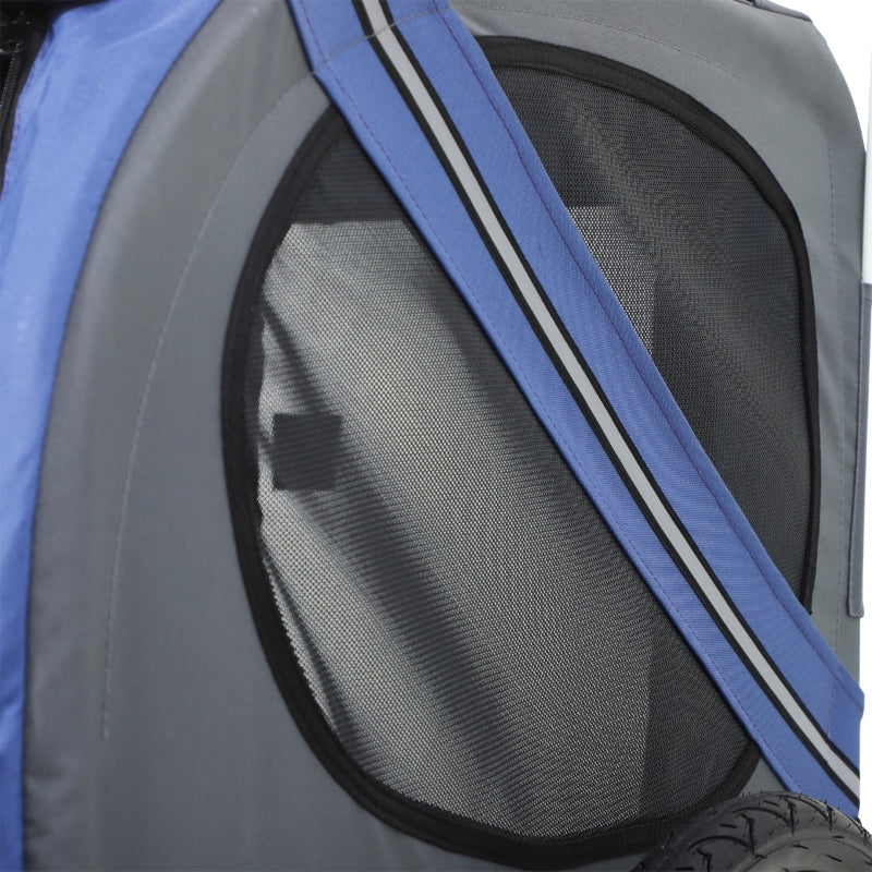 Close-up of a pet carrier with blue and gray sides.