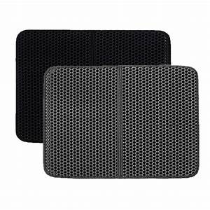 Two black honeycomb filter pads on a white background