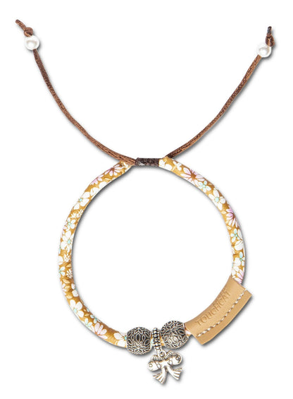 Necklace with floral pattern and decorative elements on a white background