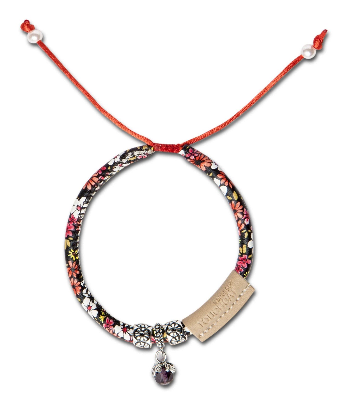 Necklace with floral pattern, red cord, and pendant on a white background