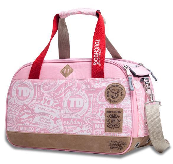 Pink duffel bag with red handles and brown accents on a white background