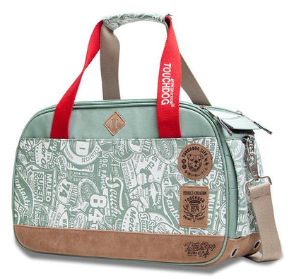 Pet carrier with red handle and patterned design on a white background