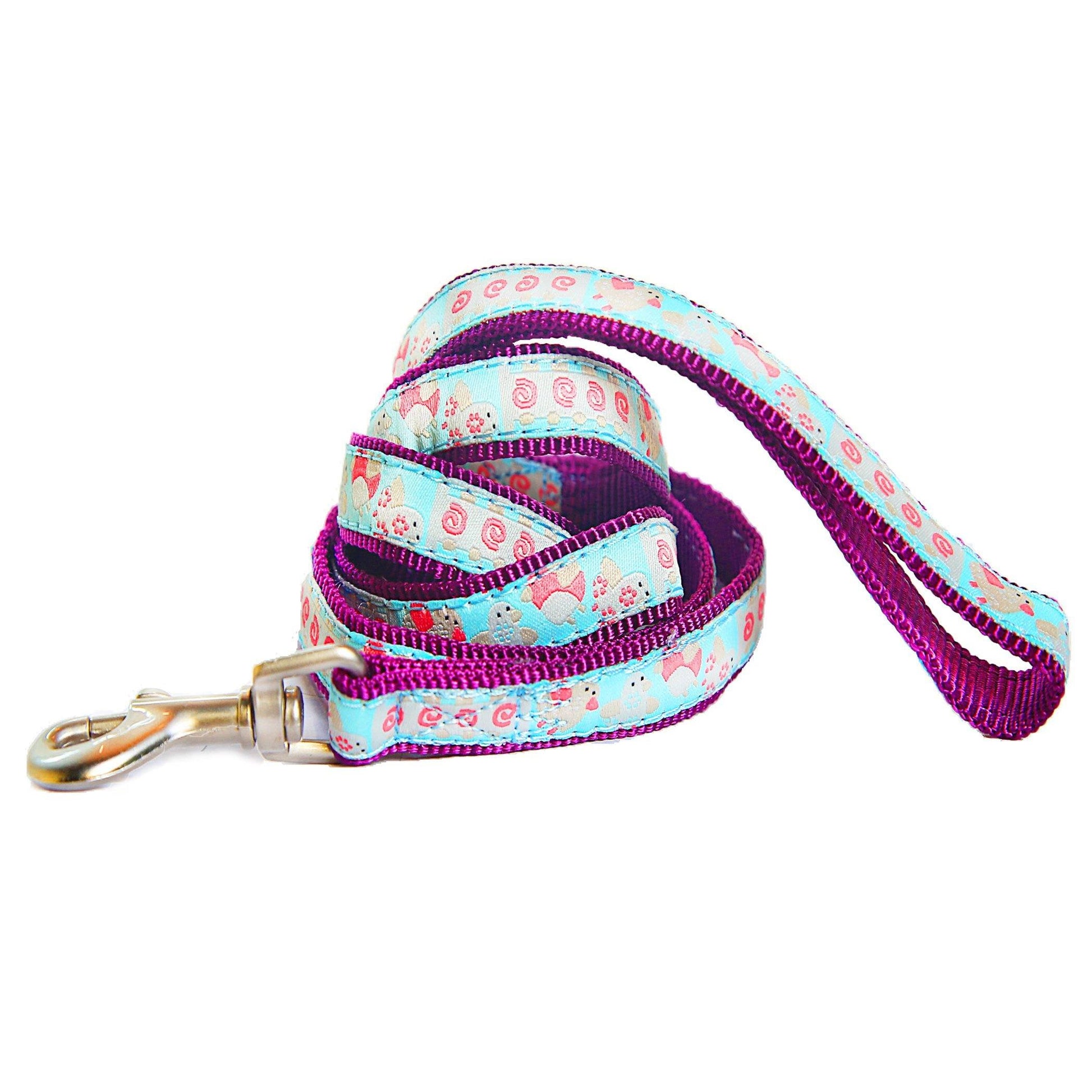 Dog leash with floral pattern and purple accents on a white background