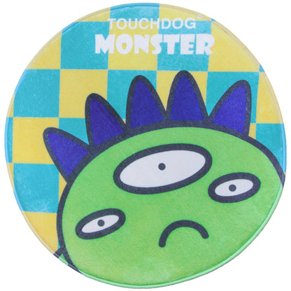 Round green monster toy with blue spikes on a checkered yellow and blue background, branded 'Touchdog Monster'.