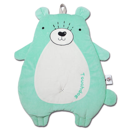 Green bear-shaped pillow with a white belly on a white background