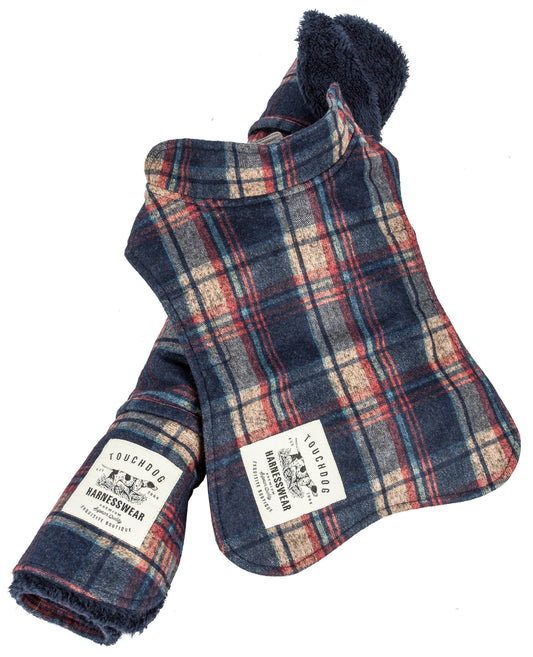 Plaid dog harness vest with brand label on a white background