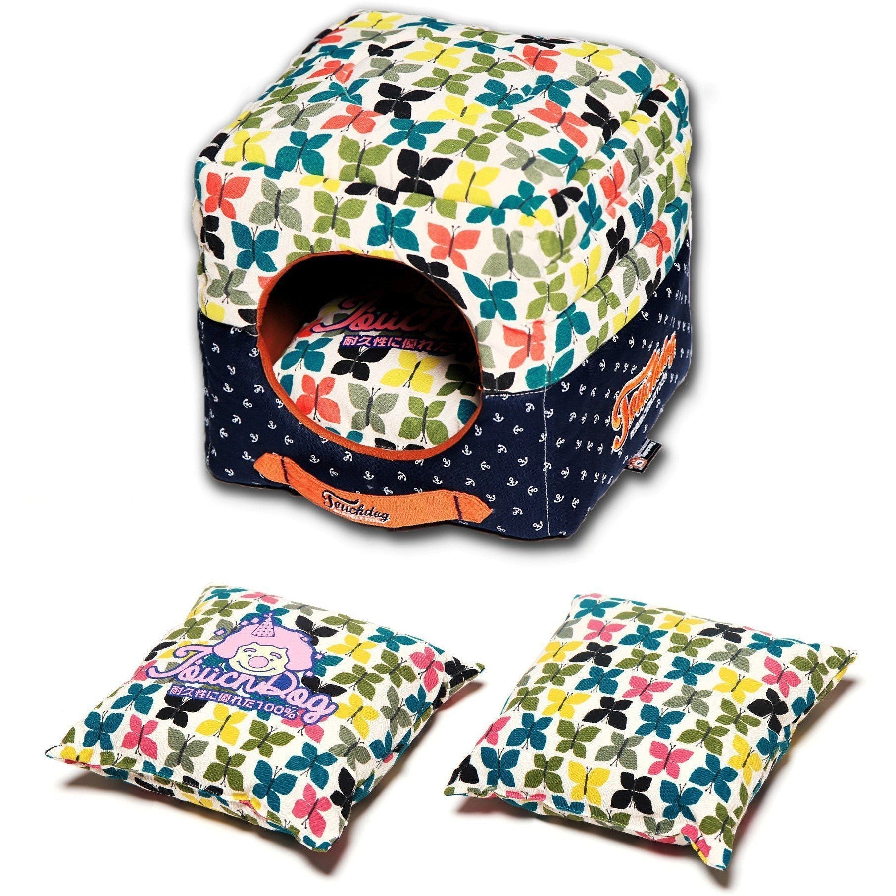 Colorful butterfly-patterned pet house with two matching pillows on a white background