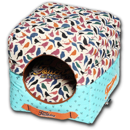Colorful pet bed with bird pattern and Teckfeed branding on a white background