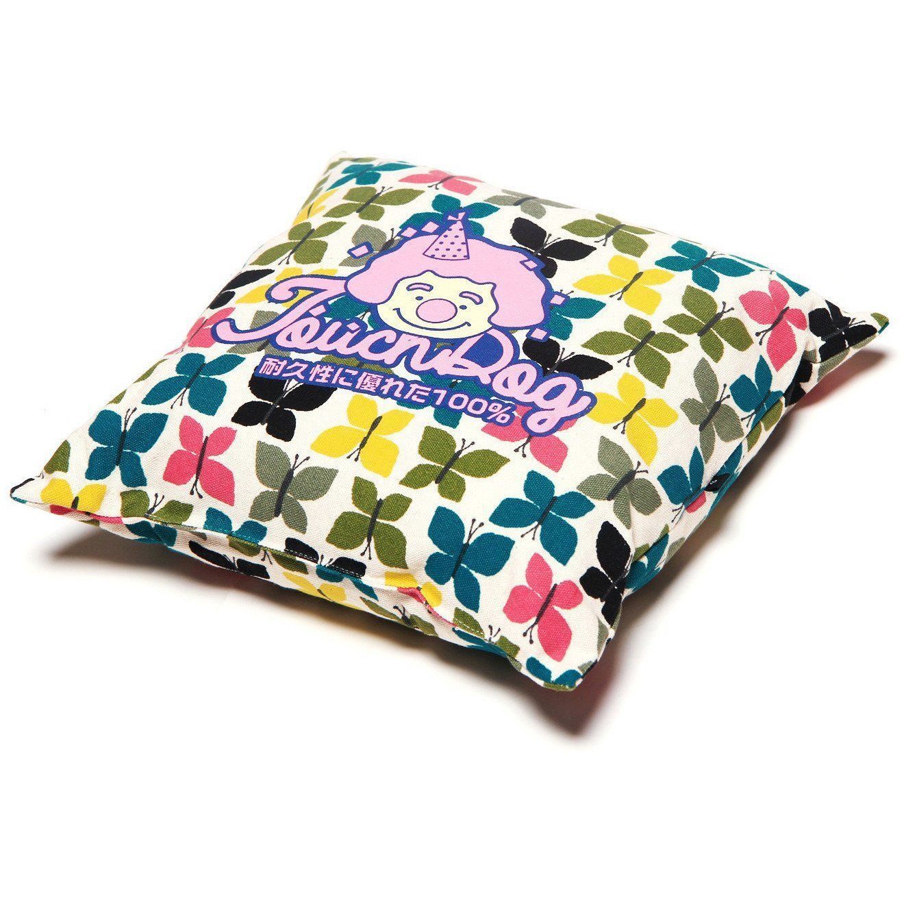 Decorative pillow with colorful butterfly pattern and cartoon character on a white background