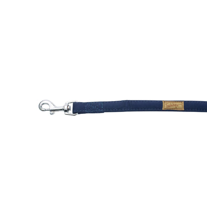 Navy blue dog leash with metal clip on a white background