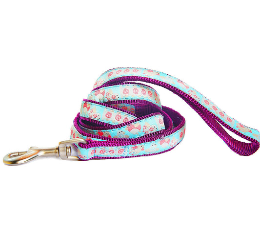 Dog leash with floral pattern and purple handle on a white background