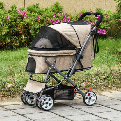 Pet stroller with a small dog inside, outdoors on a paved path with greenery.