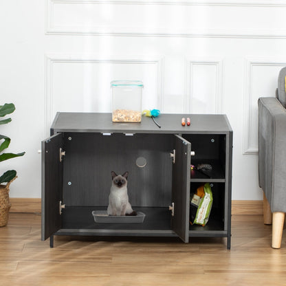 Gray pet enclosure with a cat inside in a room with a plant and furniture.